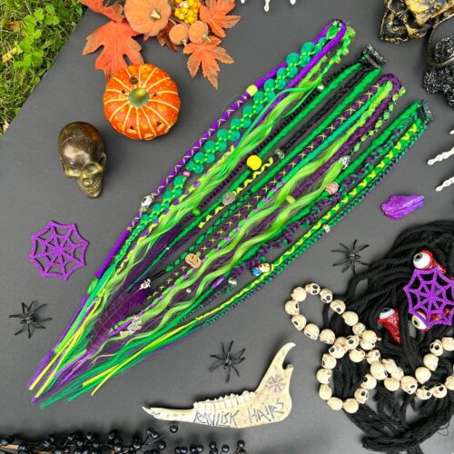 Halloween Clip-Ins! We can make an XL Ponytail version with elastic band (15 ends) instead of Clip-Ins. With dreads and braids, brushable curls! Black, green and purple! Spooky decorated with charms and beads, feather and ribbons! HALLOWEEN483