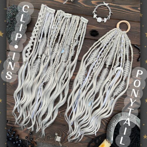 A new arrival – READY TO SHIP! Opaline Moon Clip-Ins OR XL-Ponytail. Pearl Platinum Blonde - Perfect for graying hair and blondes, while also creating a beautiful contrast with dark hair! Includes decorated dreads and braids with brushable curl ends. Decorated with real stones - Opal and Moonstone, various moons and crescents, hair Tinsel, ribbons. CLIPS615